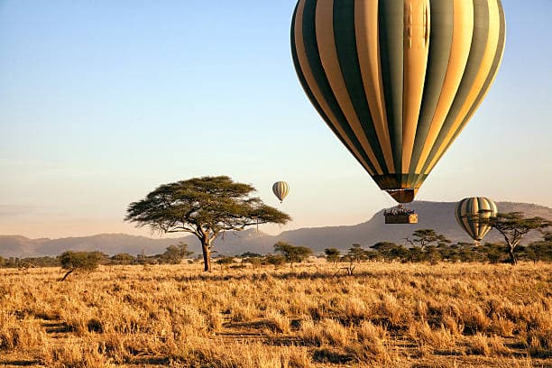 Hot air balloon safari over the Serengeti at golden hour